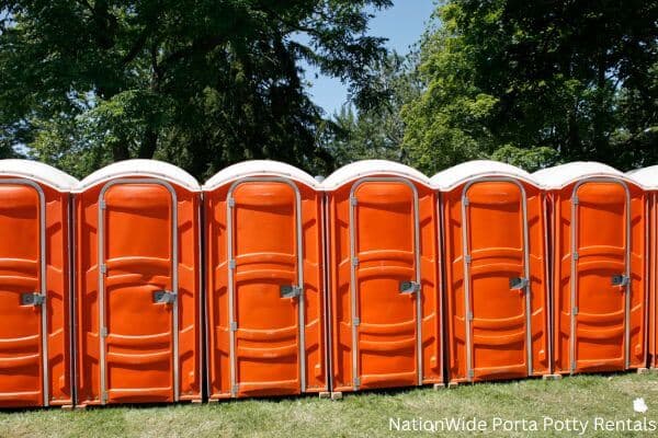a lineup of clean and well-maintained portable loos for workers in Honeyville, UT